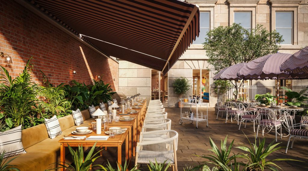 Outdoor restaurant patio in Covent Garden with wooden tables, cushioned bench seating, white chairs, and elegant table settings. Potted plants and striped awnings surround round tables with purple striped umbrellas in a sunny courtyard.