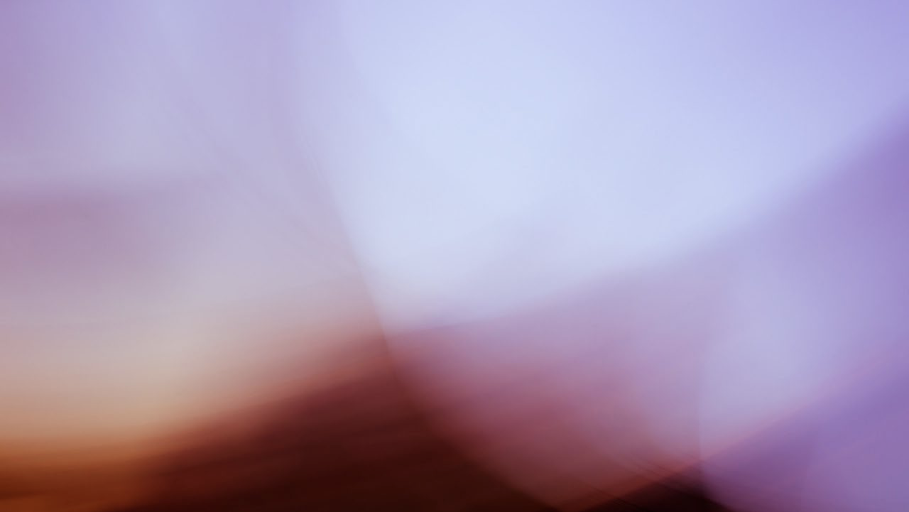 Abstract image inspired by The Webster, with soft, blurred swirls of purple, pink, and light blue tones blending together—creating a dreamy and ethereal effect without distinct shapes or objects.