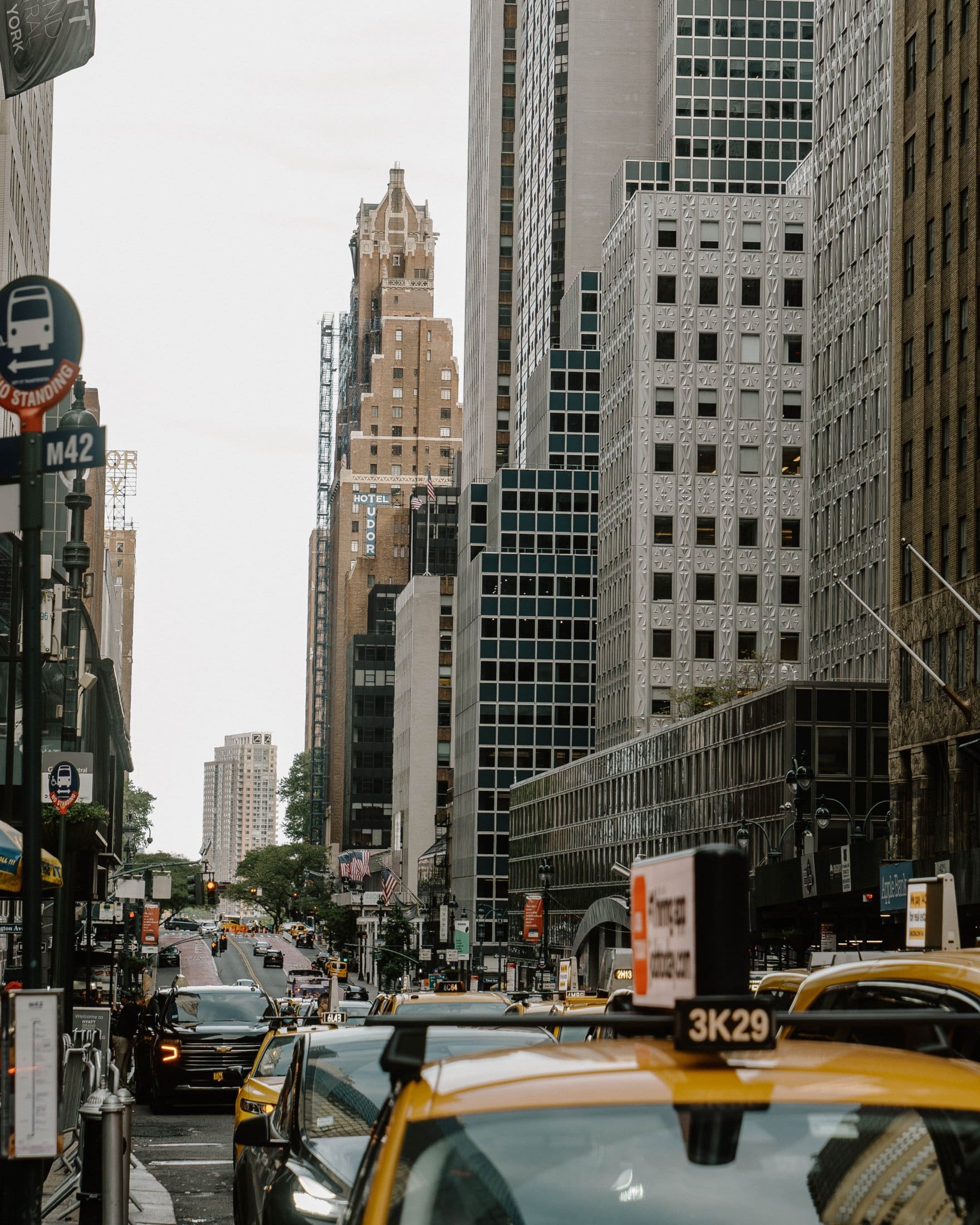 New York City street with skyline and yellow taxi cabs
